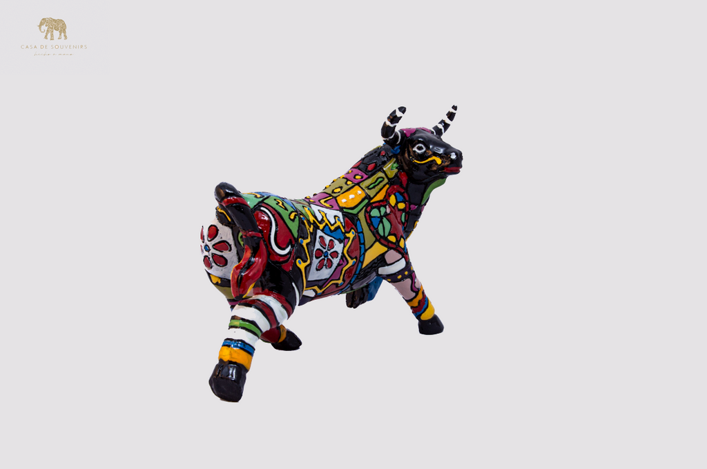 Hand Painted Black Bull statue with Red And Black Tail made with marble dust and with enamel. It's the best collection in Spain.