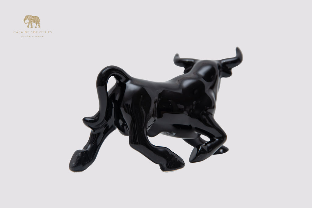 This is a sleek and elegant black bull figurine made of high-quality porcelain From Spain