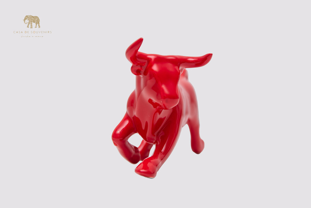 This is a sleek and elegant Red bull figurine made of high-quality porcelain
