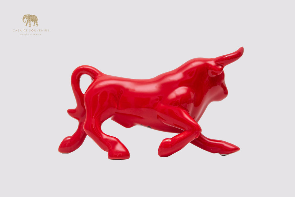 This is a sleek and elegant Red bull figurine made of high-quality porcelain