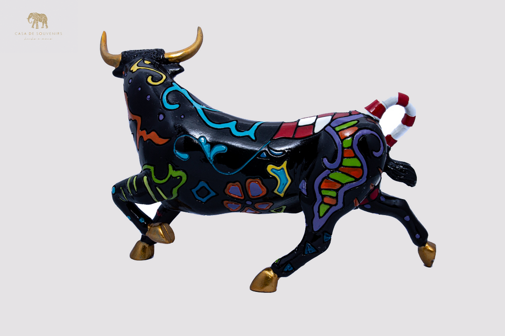 Hand Painted Black Bull statue with Red And White Tail made with marble dust and with enamel. It's the best collection in Spain.