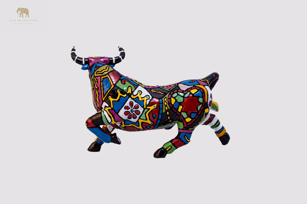 Hand Painted Black Bull statue with Red And Black Tail made with marble dust and with enamel. It's the best collection in Spain.