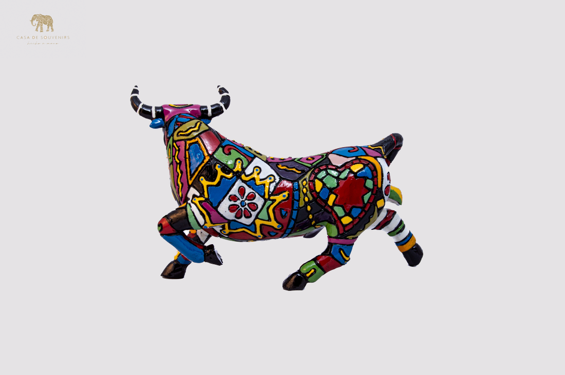 Hand Painted Black Bull statue with Red And Black Tail made with marble dust and with enamel. It's the best collection in Spain.