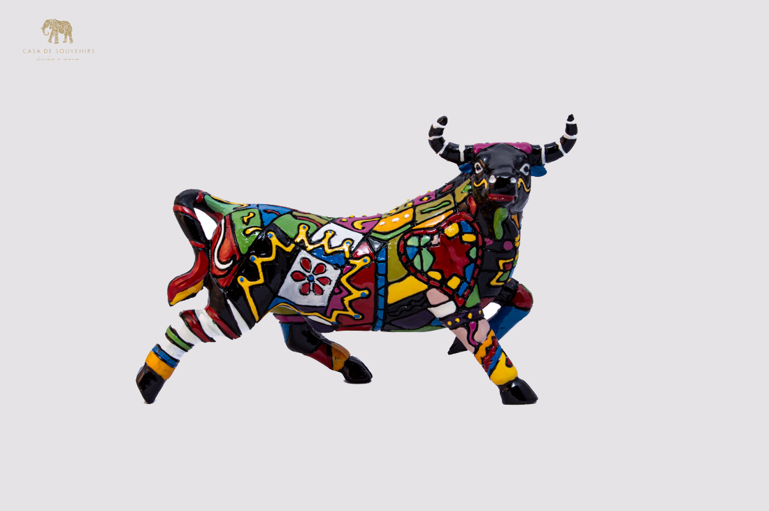 Hand Painted Black Bull statue with Red And Black Tail made with marble dust and with enamel. It's the best collection in Spain.
