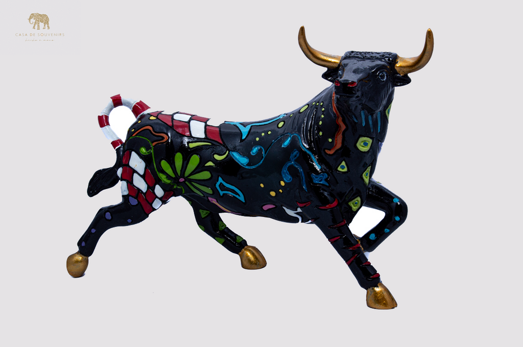 Hand Painted Black Bull statue with Red And White Tail made with marble dust and with enamel. It's the best collection in Spain.