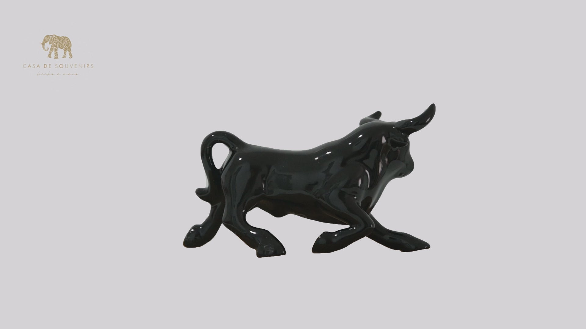 This is a sleek and elegant black bull figurine made of high-quality porcelain From Spain